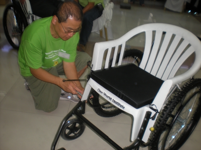 Eddie Evangelista assembling a wheelchair. 