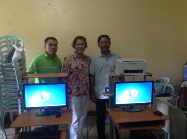 Ms. Elsie Navarro-Amansec, OMASC Director and Past President, presenting donation of  1 computer system to Naujan Municipal High School- Feb 2014.
