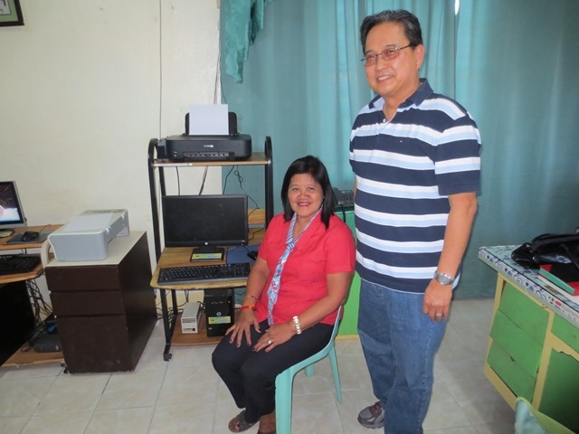 Ms. Cusi, OMNHS Librarian and Dan Nable, OMASC Director and Past President, with the 2 computer systems donated by OMASC in July 2013 in the background.