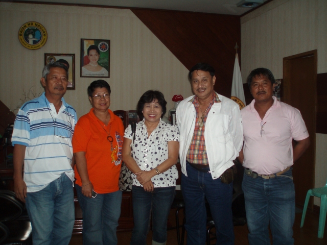 Municipal Administrator Gutierrez, MSW Edna Llamoso and Diomeng (?) at far right, Municipal Agriculturist who is requesting seeds for the farmers.