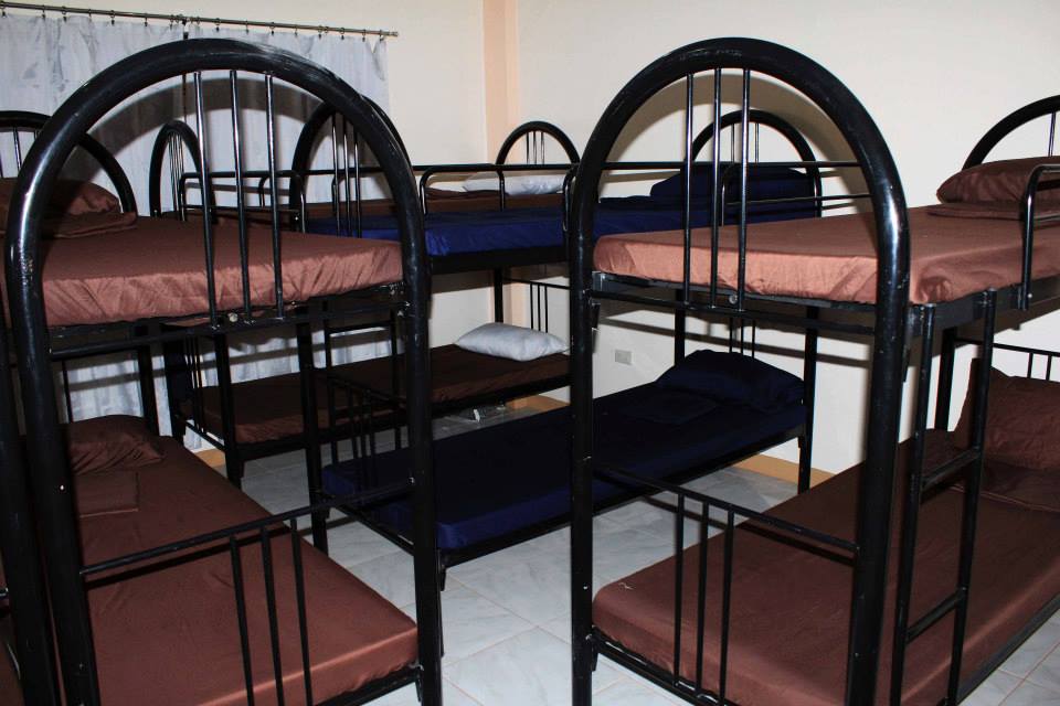 Room with multiple double deck/bunk beds